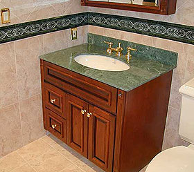 bathroom with custom tile and marble top sink